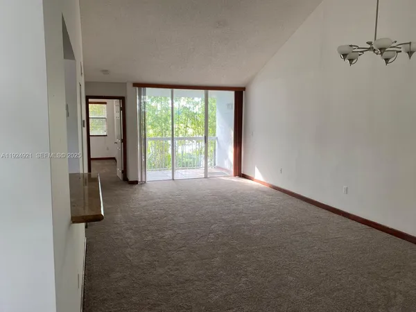 a view of empty room with windows