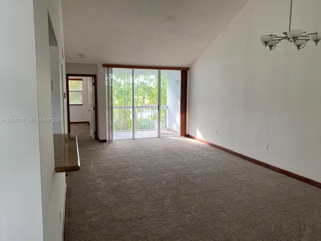 a view of empty room with windows