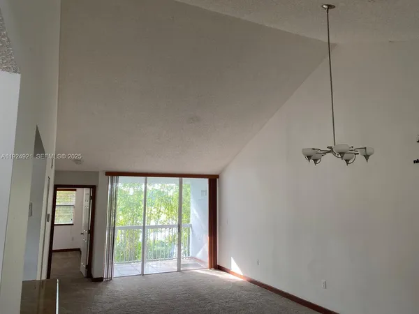 a view of a room with a large window