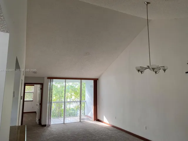 a view of a room with a large window