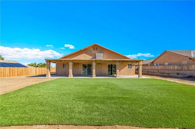 an aerial view of residential house and green space