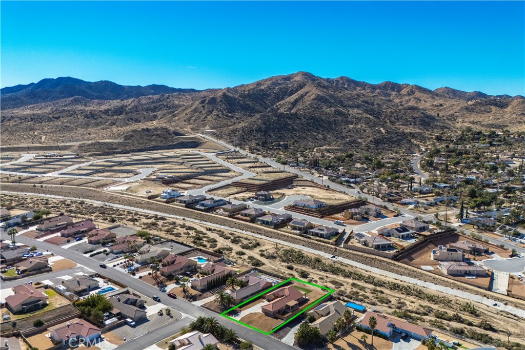 57031 Selecta Avenue Yucca Valley, CA 92284 - Photo 39 of 56 an aerial view of residential houses with outdoor space
