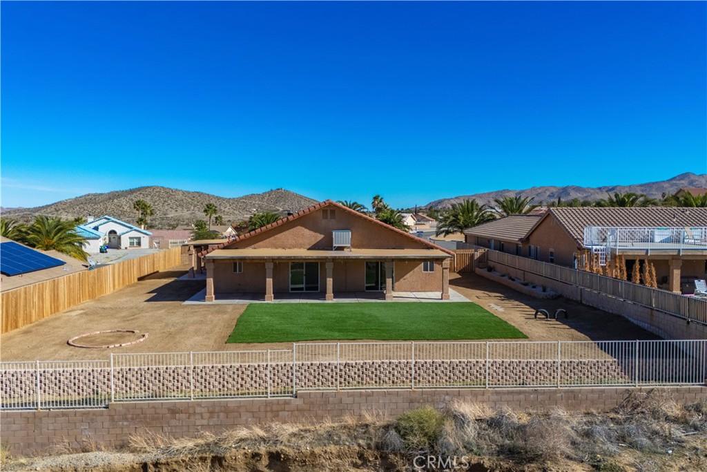 57031 Selecta Avenue Yucca Valley, CA 92284 - Photo 44 of 56 a view of a house with a yard