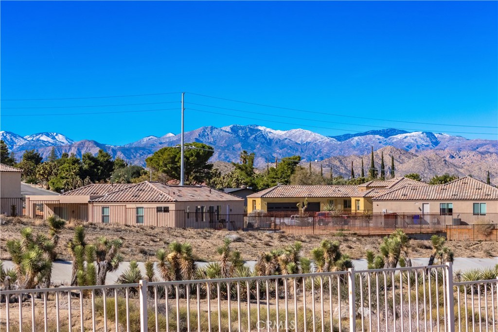 57031 Selecta Avenue Yucca Valley, CA 92284 - Photo 49 of 56 a front view of a house with a yard