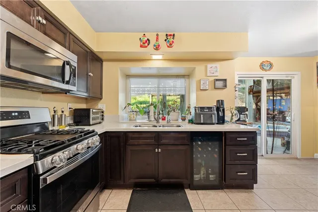 a kitchen with stainless steel appliances a sink and a stove