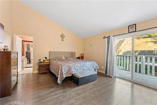 a bedroom with a bed and a night stand