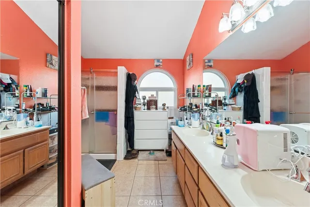 a dining room with furniture and a potted plant