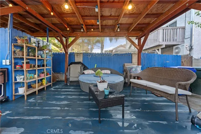 a view of a chairs and table in a patio