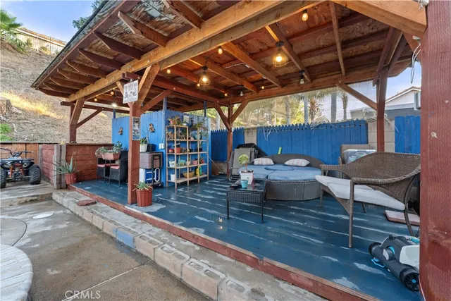 a view of a dining room with furniture wooden floor and a potted plant