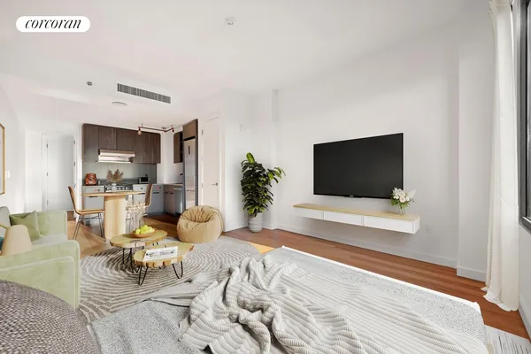 a bedroom with bed and a flat screen tv