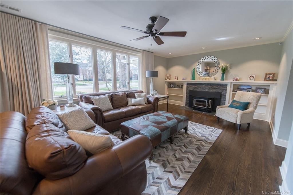 2837 Sharon Road Charlotte, NC 28211 - Photo 2 of 24 a living room with furniture a large window and a fireplace