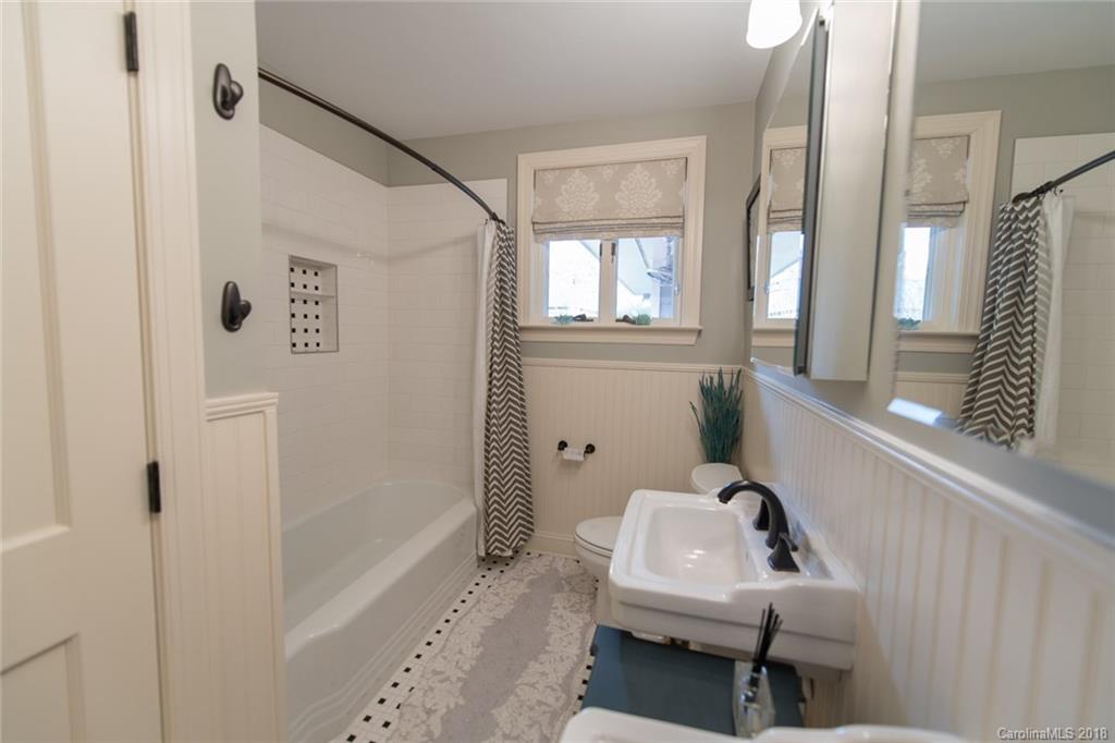 2837 Sharon Road Charlotte, NC 28211 - Photo 12 of 24 a bathroom with a sink a toilet and shower