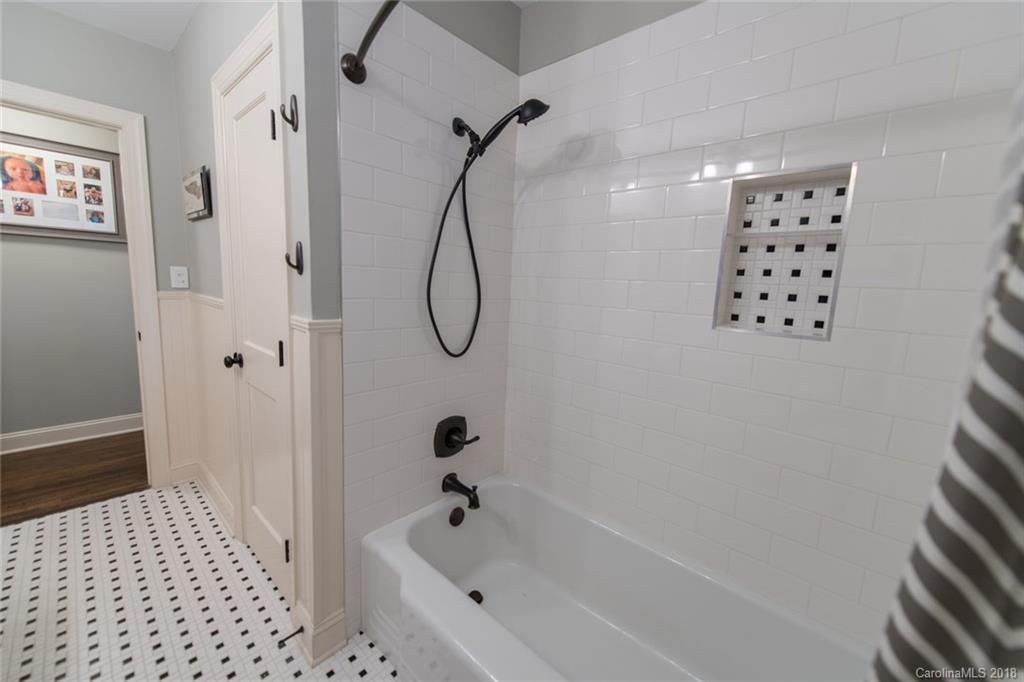2837 Sharon Road Charlotte, NC 28211 - Photo 13 of 24 a bathroom with a bathtub and shower