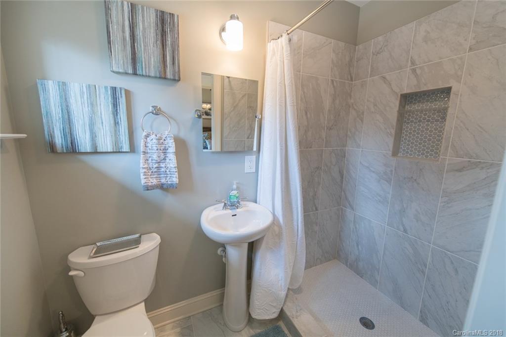 2837 Sharon Road Charlotte, NC 28211 - Photo 16 of 24 a bathroom with a sink toilet and shower