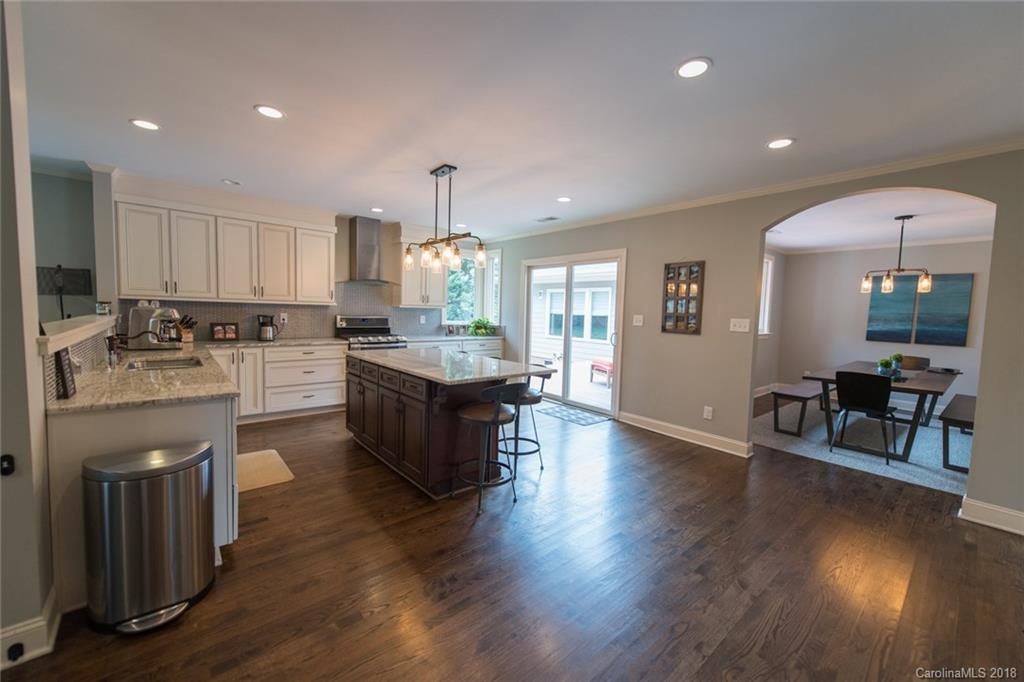 2837 Sharon Road Charlotte, NC 28211 - Photo 6 of 24 a kitchen with a sink cabinets and wooden floor