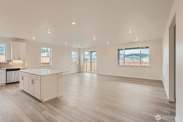 a view of kitchen dining table chairs cabinets and wooden floor