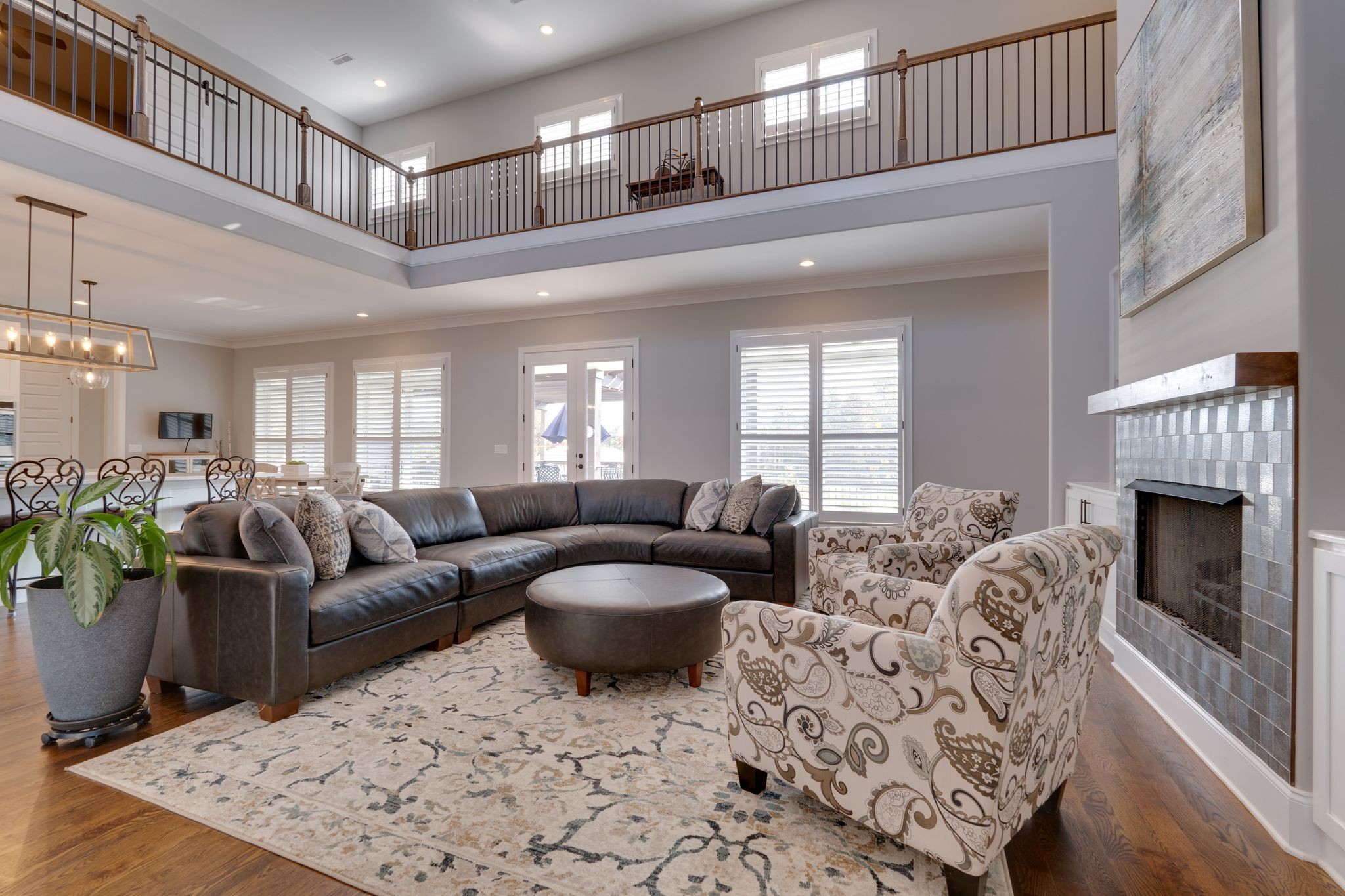 4285 Franklin Road Lebanon, TN 37090 - Photo 18 of 90 a living room with furniture a fireplace and a chandelier