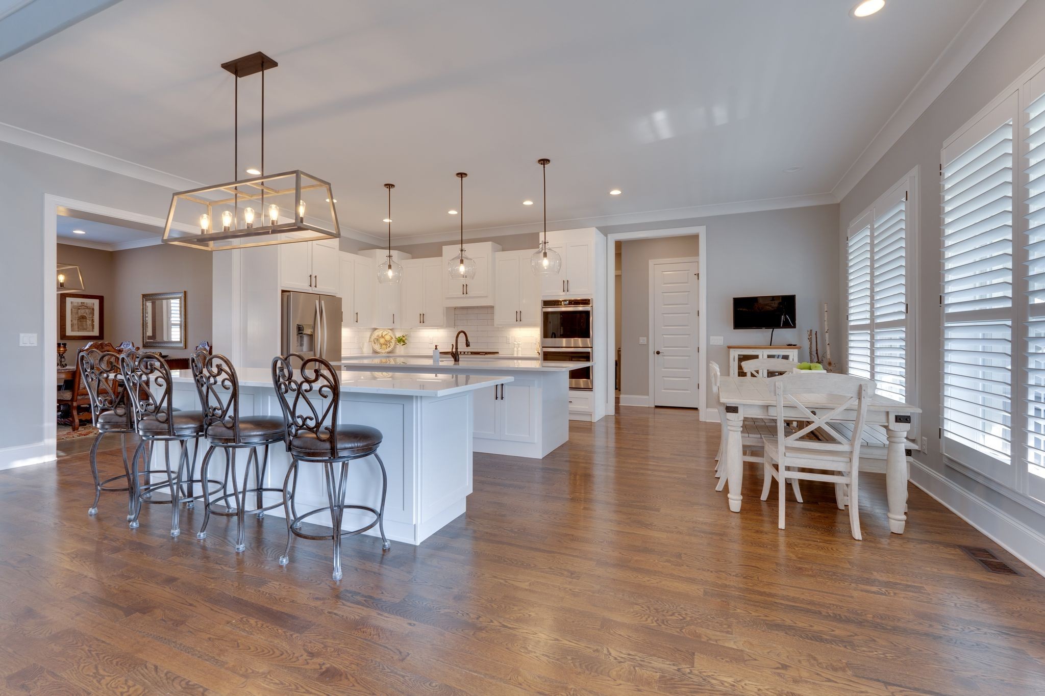 4285 Franklin Road Lebanon, TN 37090 - Photo 25 of 90 a view of a dining room and livingroom with furniture wooden floor a chandelier
