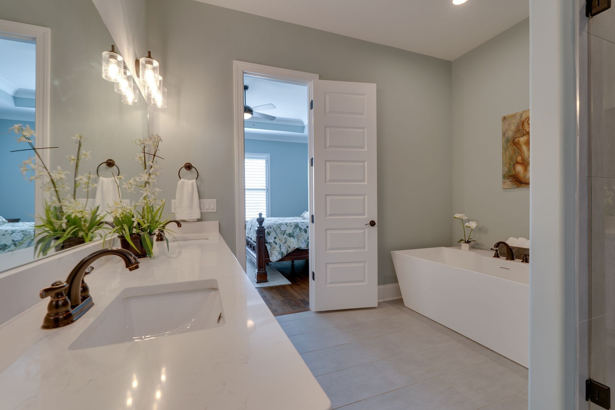 4285 Franklin Road Lebanon, TN 37090 - Photo 44 of 90 a bathroom with a sink a faucet a potted plant and a mirror