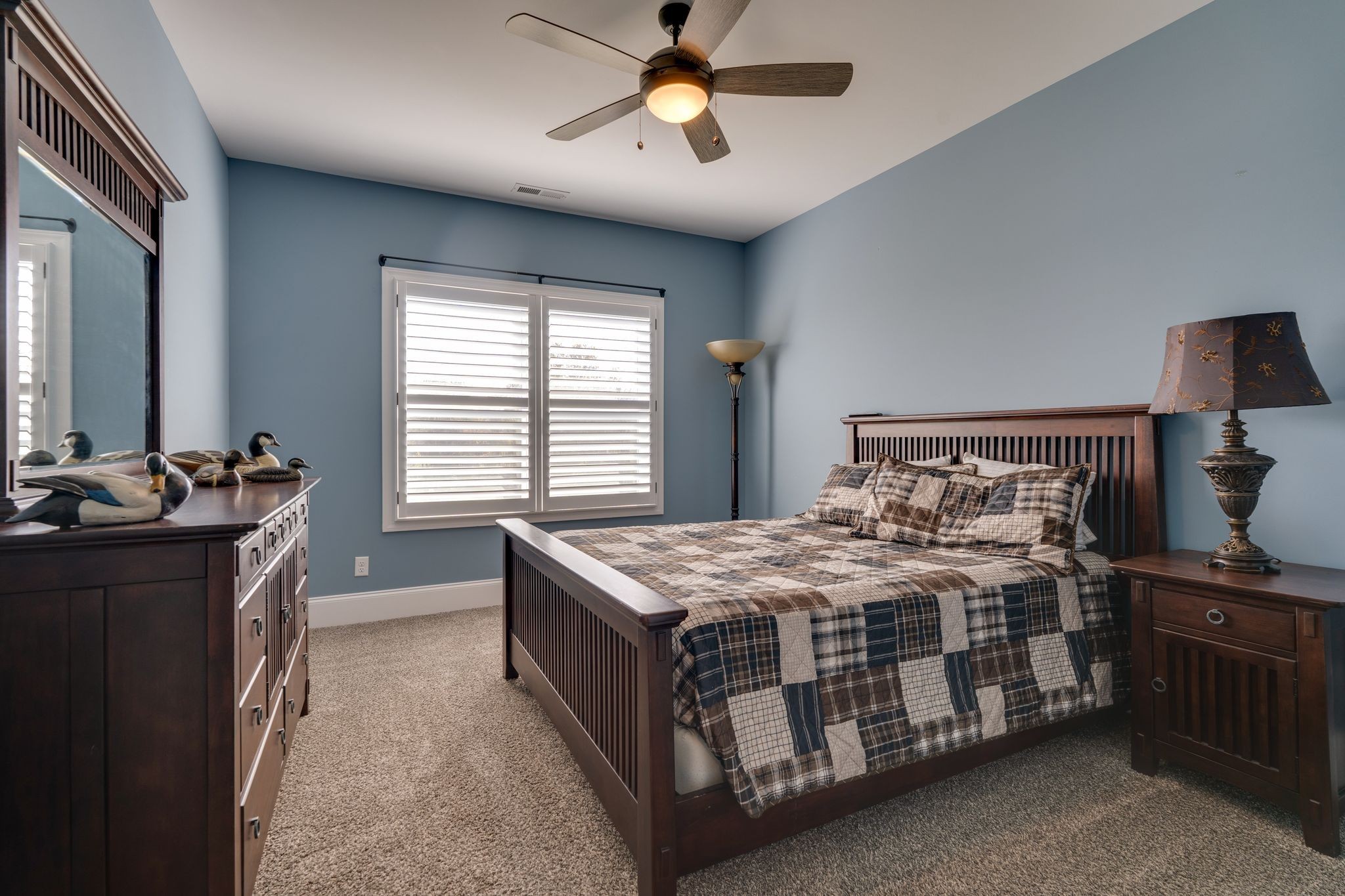 4285 Franklin Road Lebanon, TN 37090 - Photo 53 of 90 a bedroom with a bed next to a window and a chandelier
