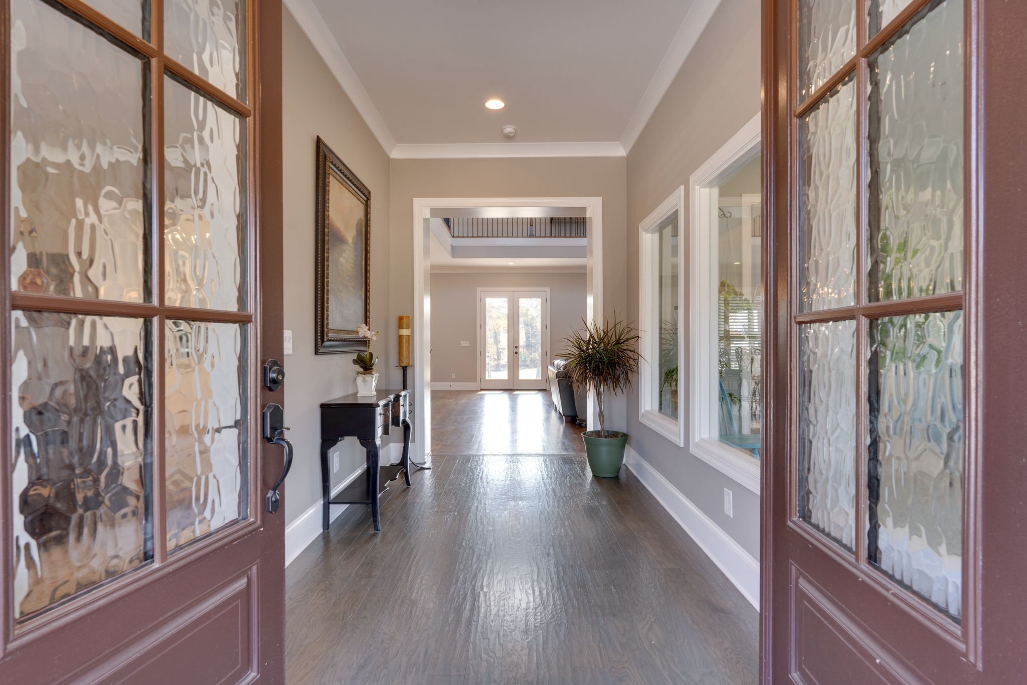 4285 Franklin Road Lebanon, TN 37090 - Photo 6 of 90 a view of a hallway with wooden floor and livingroom with furniture