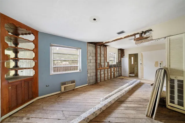 a view of a hallway with an entryway