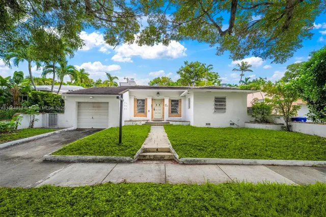 front view of a house with a yard