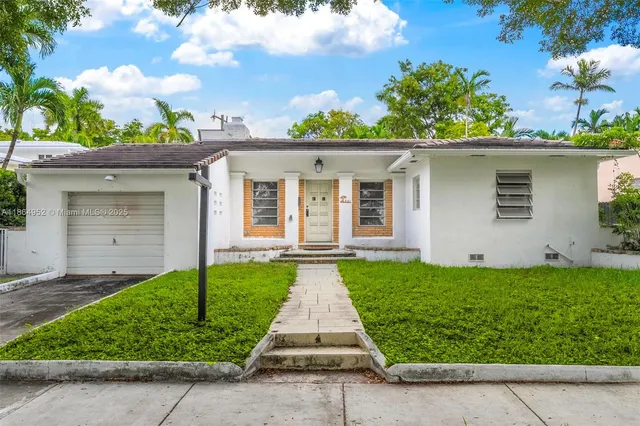 front view of a house with a yard