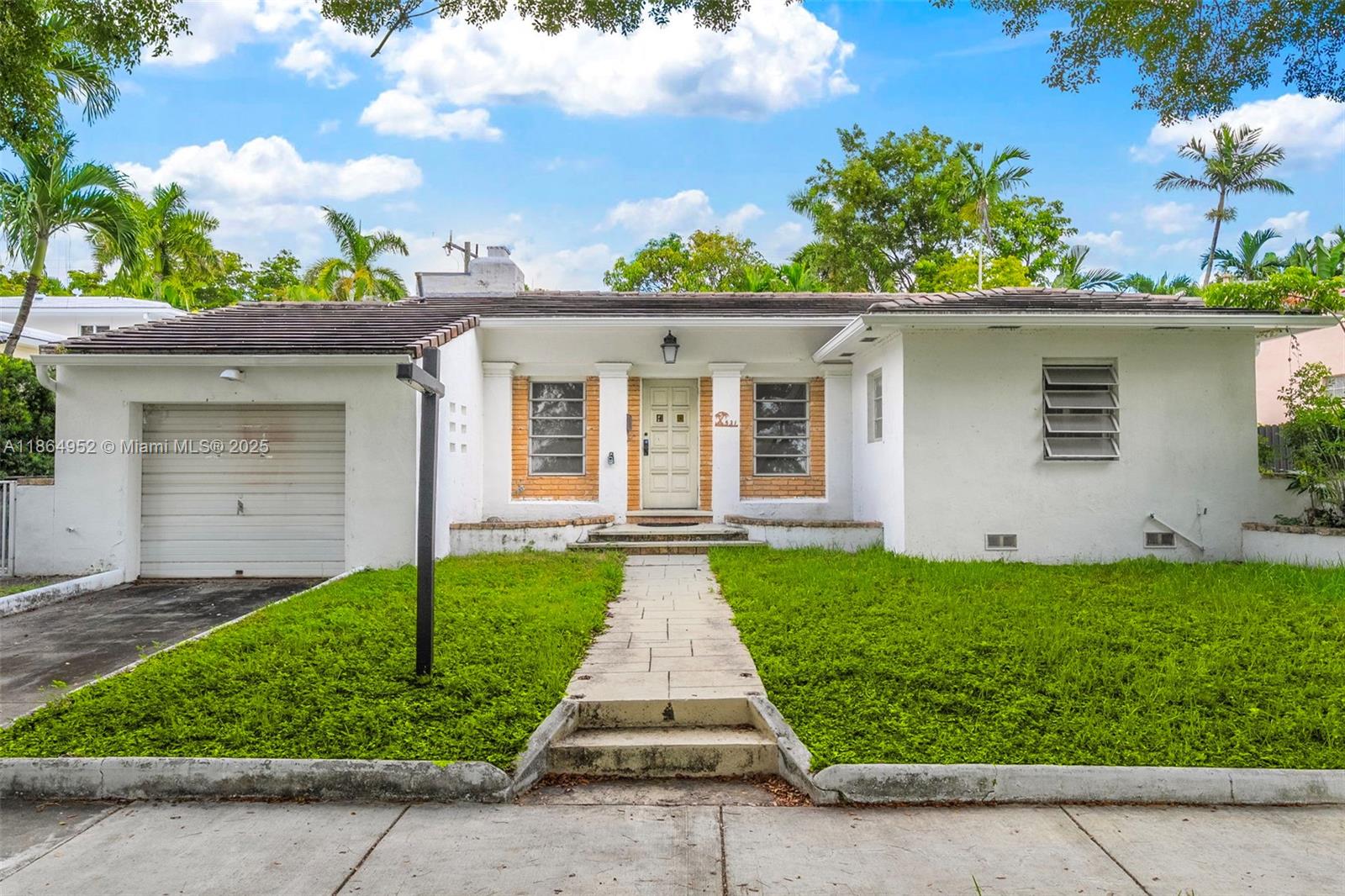 531 Northeast 55th Terrace Miami, FL 33137 - Photo 2 of 15 front view of a house with a yard