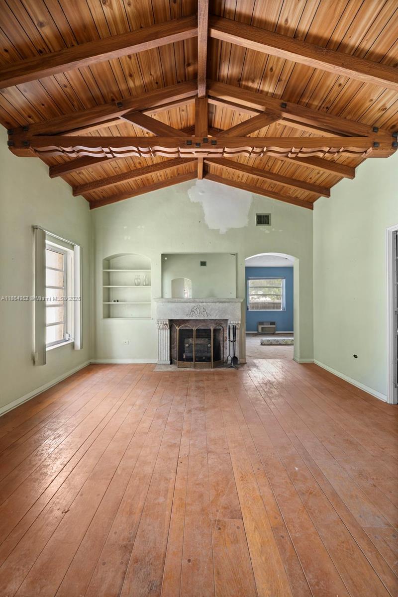 531 Northeast 55th Terrace Miami, FL 33137 - Photo 4 of 15 a view of a livingroom with a fireplace and window