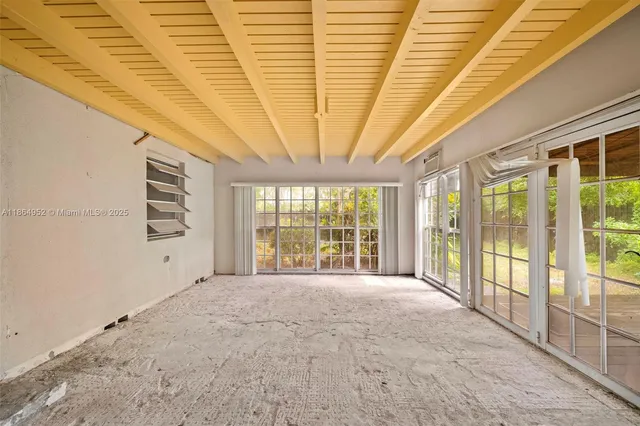 a view of an empty room with a sliding door