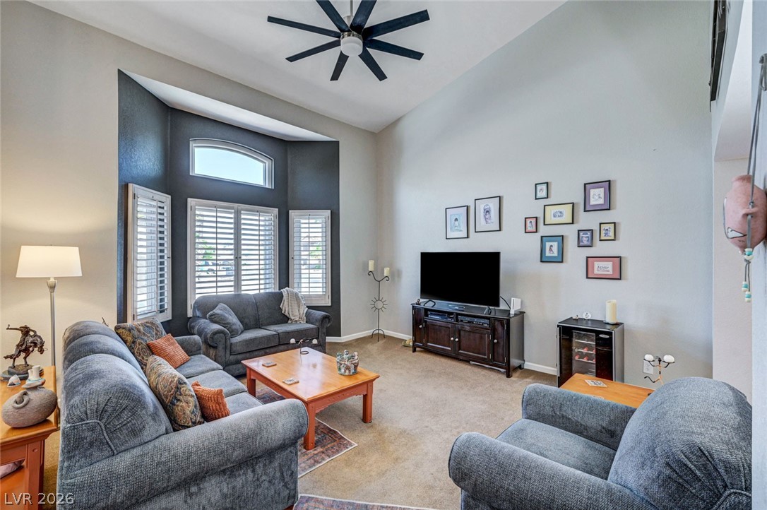2600 Frontera Road Henderson, NV 89074 - Photo 10 of 47 Front living room with bay window, shutters, vaulted ceiling and ceiling fan