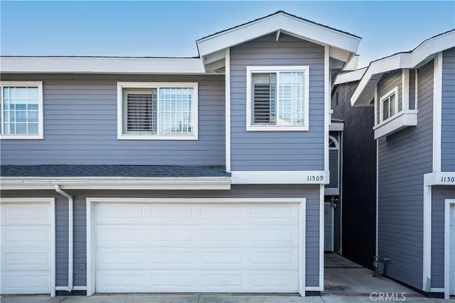 a front view of a house with a garage