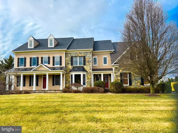 a front view of a house with a swimming pool