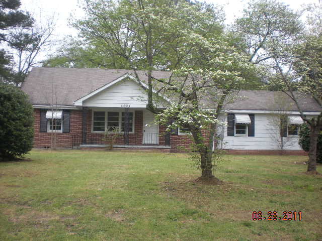 4604 Wilson Road Macon, GA 31206 - Photo 1 of 1 a front view of a house with garden