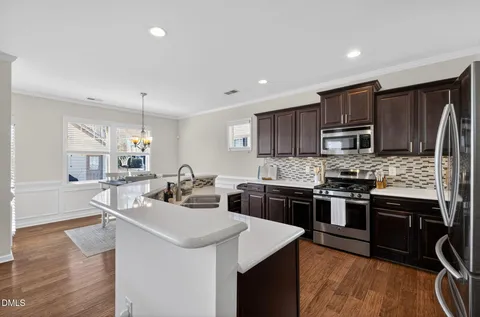 a kitchen with a stove and cabinets