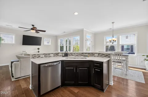 a kitchen with granite countertop a stove and a sink