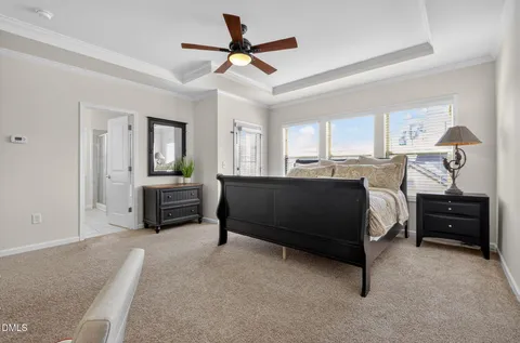 a bedroom with a bed and a television