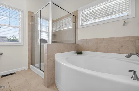 a bathroom with a sink double vanity and a mirror