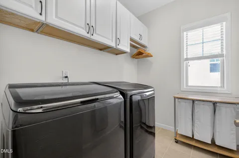 a en suite bathroom with a granite countertop sink and a mirror