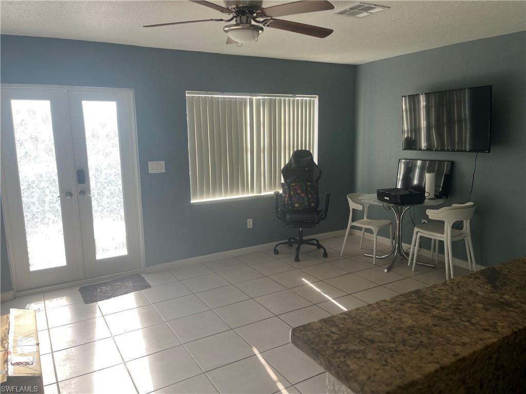 101 East Jersey Road Lehigh Acres, FL 33936 - Photo 2 of 10 a living room with furniture and a window