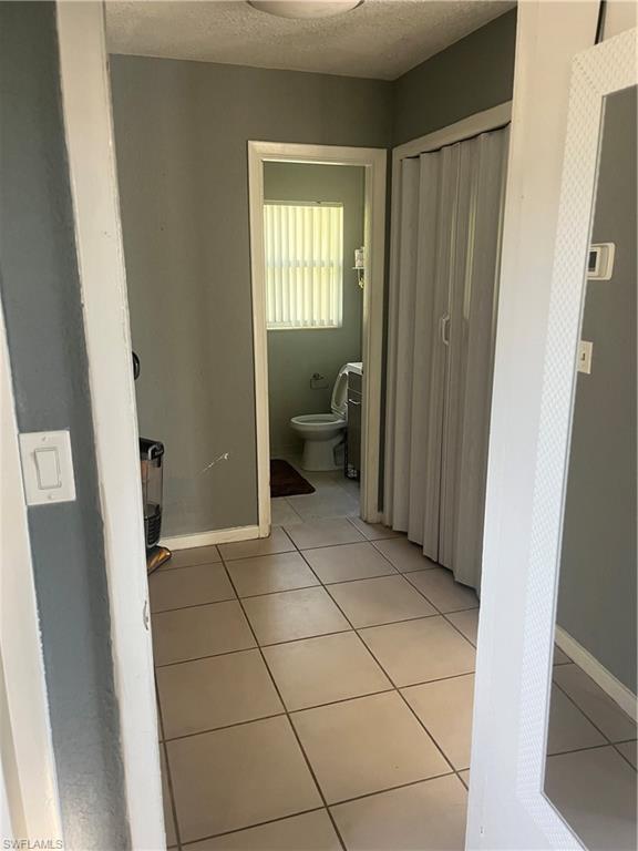 101 East Jersey Road Lehigh Acres, FL 33936 - Photo 10 of 10 a bathroom with a sink and a toilet