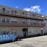 a front view of a building with many windows