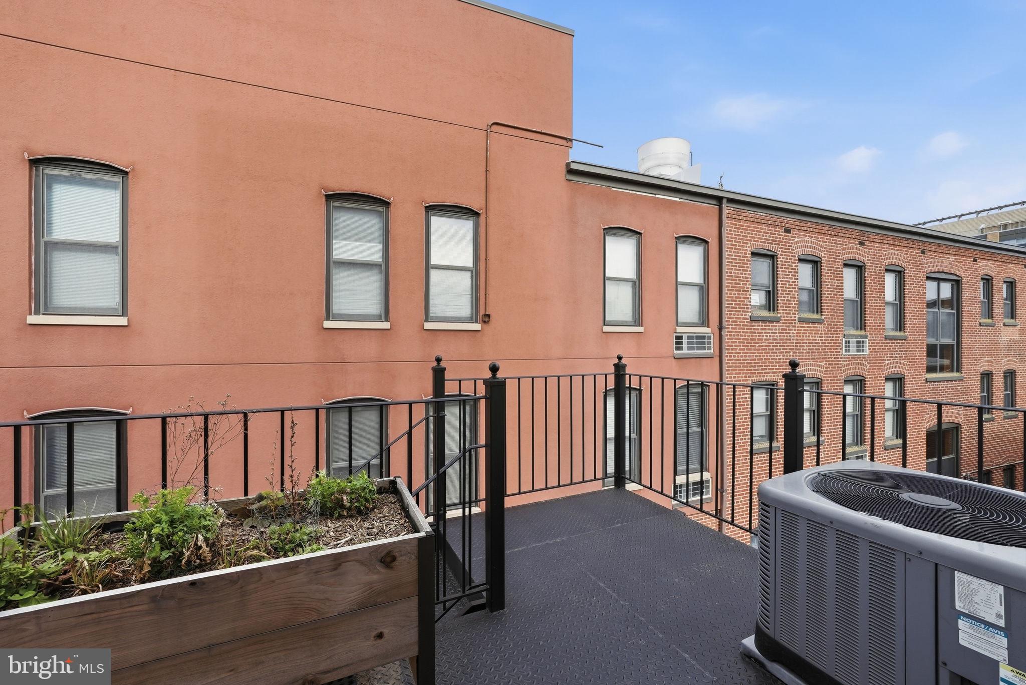 2713 Ontario Road Northwest, Unit 5 Washington, DC 20009 - Photo 15 of 35 a view of a brick house with many windows