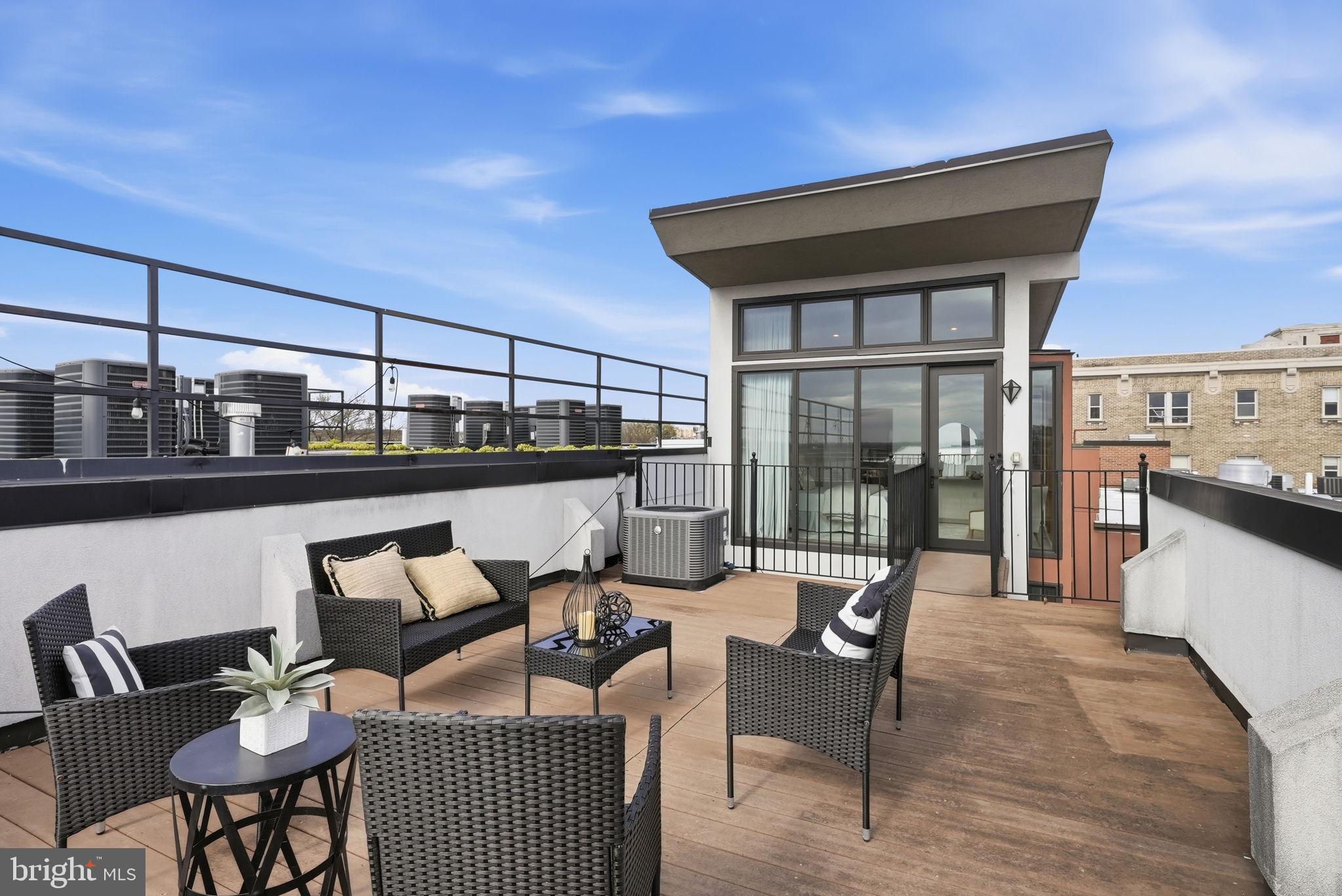 2713 Ontario Road Northwest, Unit 5 Washington, DC 20009 - Photo 29 of 35 a balcony with furniture and outdoor view