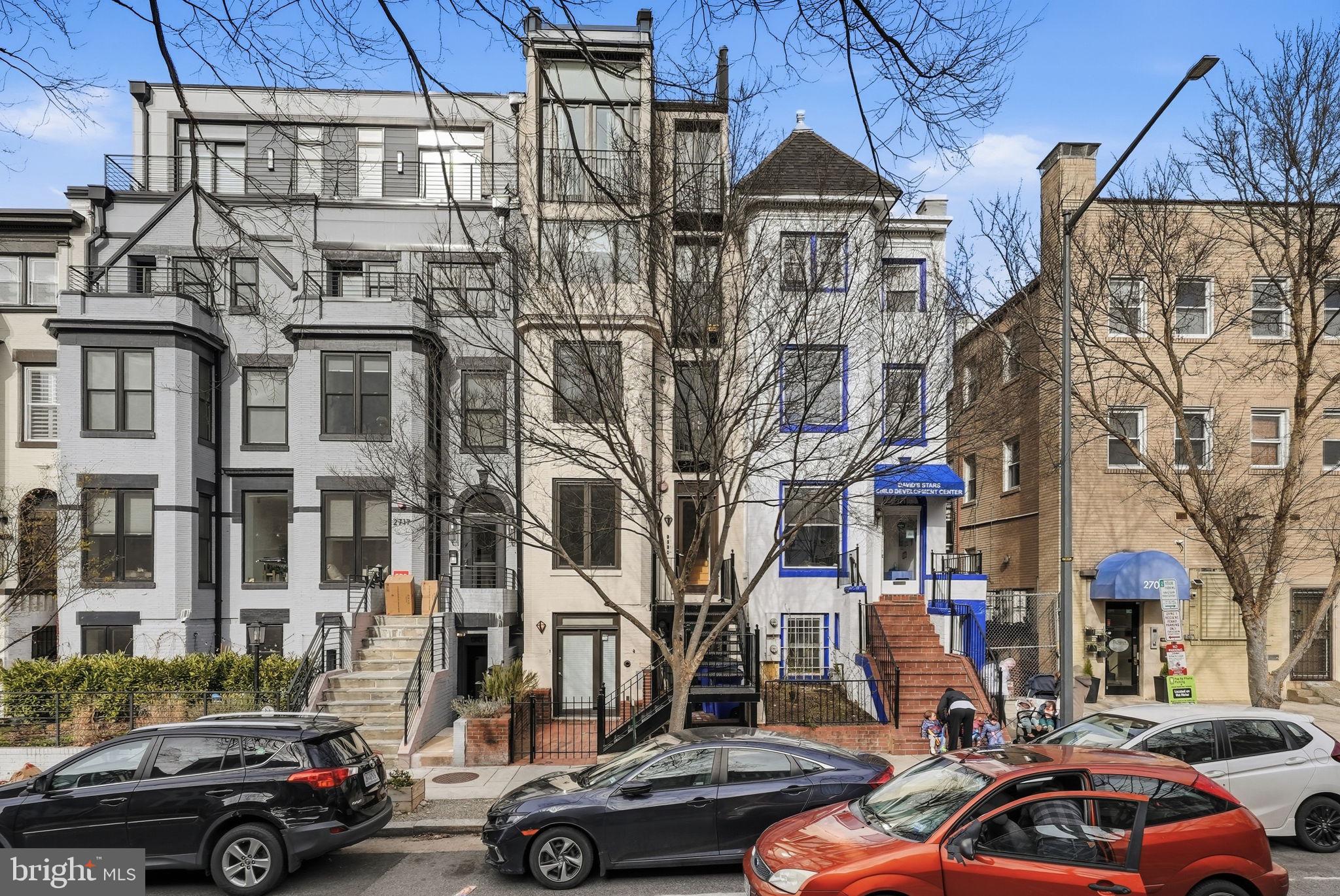 2713 Ontario Road Northwest, Unit 5 Washington, DC 20009 - Photo 3 of 35 a city street lined with buildings and cars