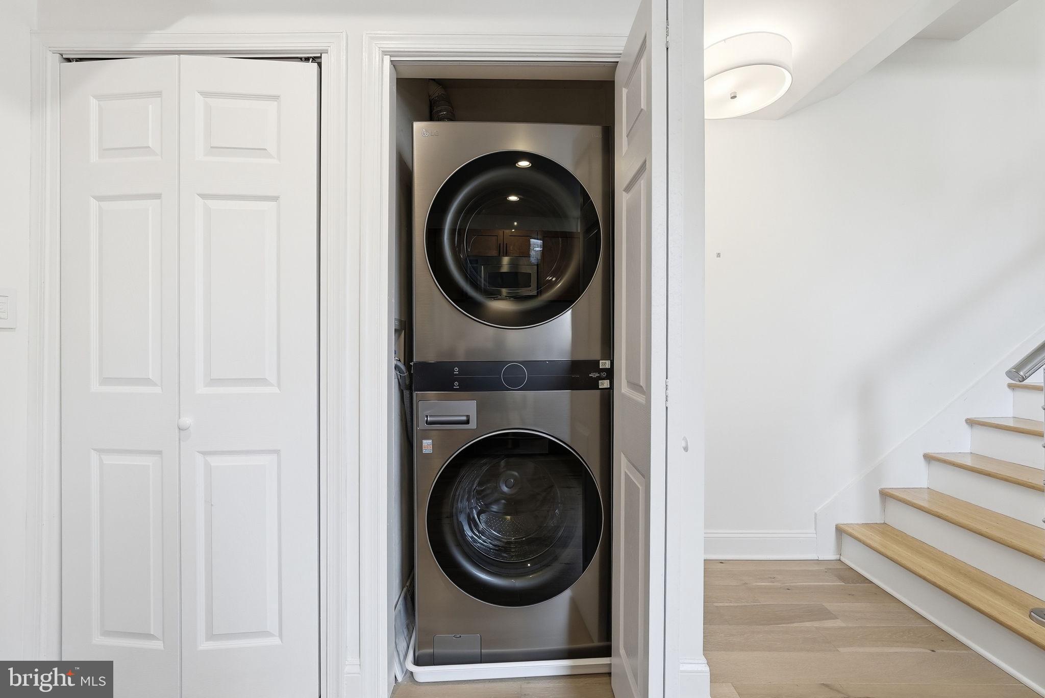 2713 Ontario Road Northwest, Unit 5 Washington, DC 20009 - Photo 9 of 35 a view of a hallway with washer and dryer