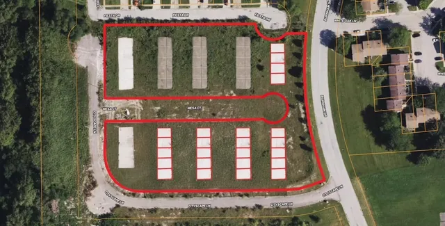 a view of a large building with a sign on the wall