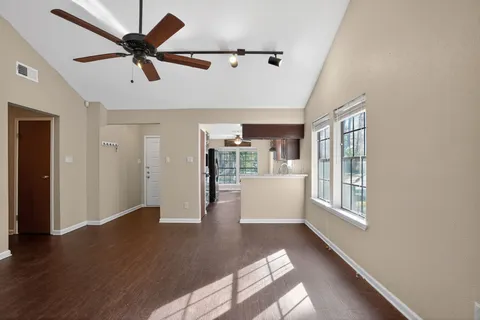 a kitchen with stainless steel appliances granite countertop a sink stove and cabinets
