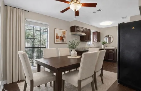 a kitchen with stainless steel appliances granite countertop a refrigerator stove and sink